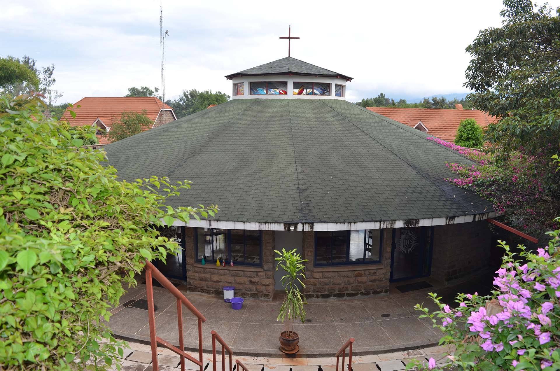 The Mwangaza retreat centre roof amid gardens